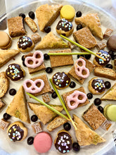 Load image into Gallery viewer, Round dessert platter with pastries, macarons, chocolate treats, pretzels and berries.