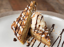 Load image into Gallery viewer, Layered dessert slices served with ice cream and chocolate drizzle.