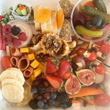 Load image into Gallery viewer, Overhead view of the Vegan Grazing Box with plant-based cheese, fruit, crackers, vegetables and dips.
